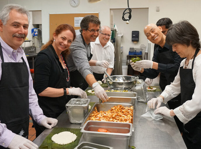 Participants of a team building exercise at they key room kitchen.