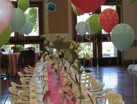 A table is decorated for a bar or bat mitzvah celebration.