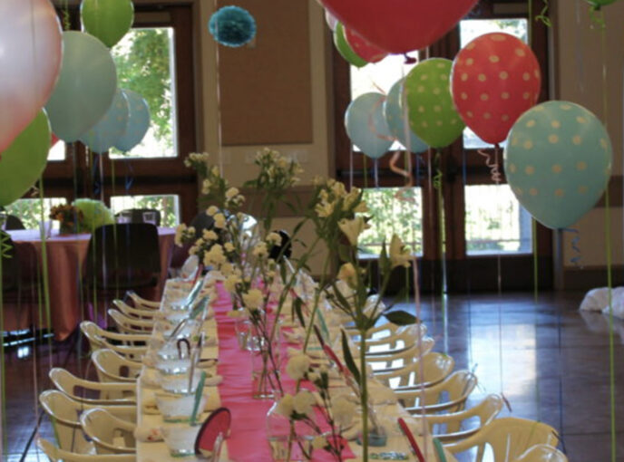 A table is decorated for a bar or bat mitzvah celebration.