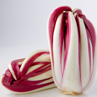 Two heads of radicchio on white background