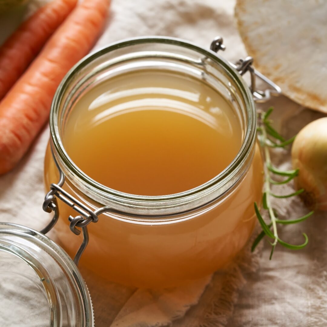 Mason jar full of hearty broth