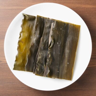 Strips of seaweed on a white plate