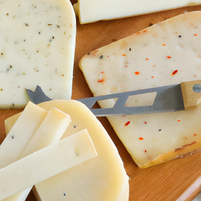 Board of assorted cheese with cheese knife